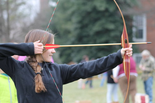 Brianna shooting a bow