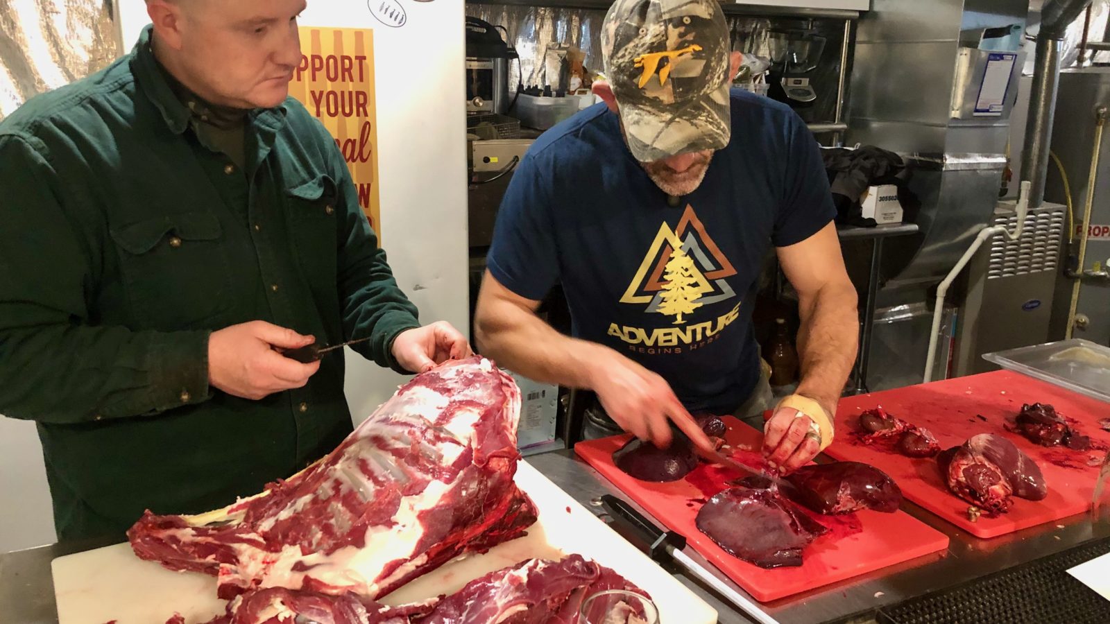 Teaching a student how to butcher a deer