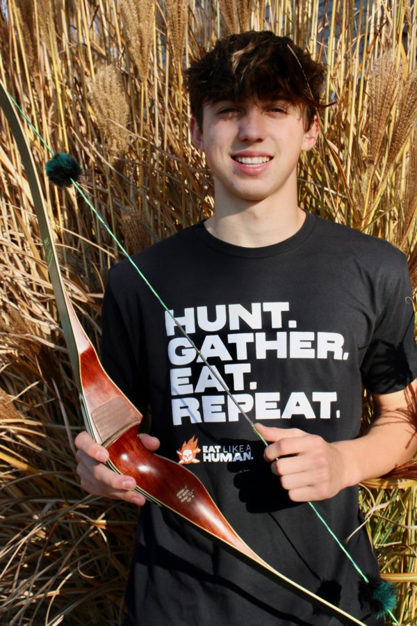 Billy with bow in Hunt Gather Eat Repeat tshirt in Black