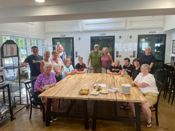 Successful cheesemaking class enjoying the product